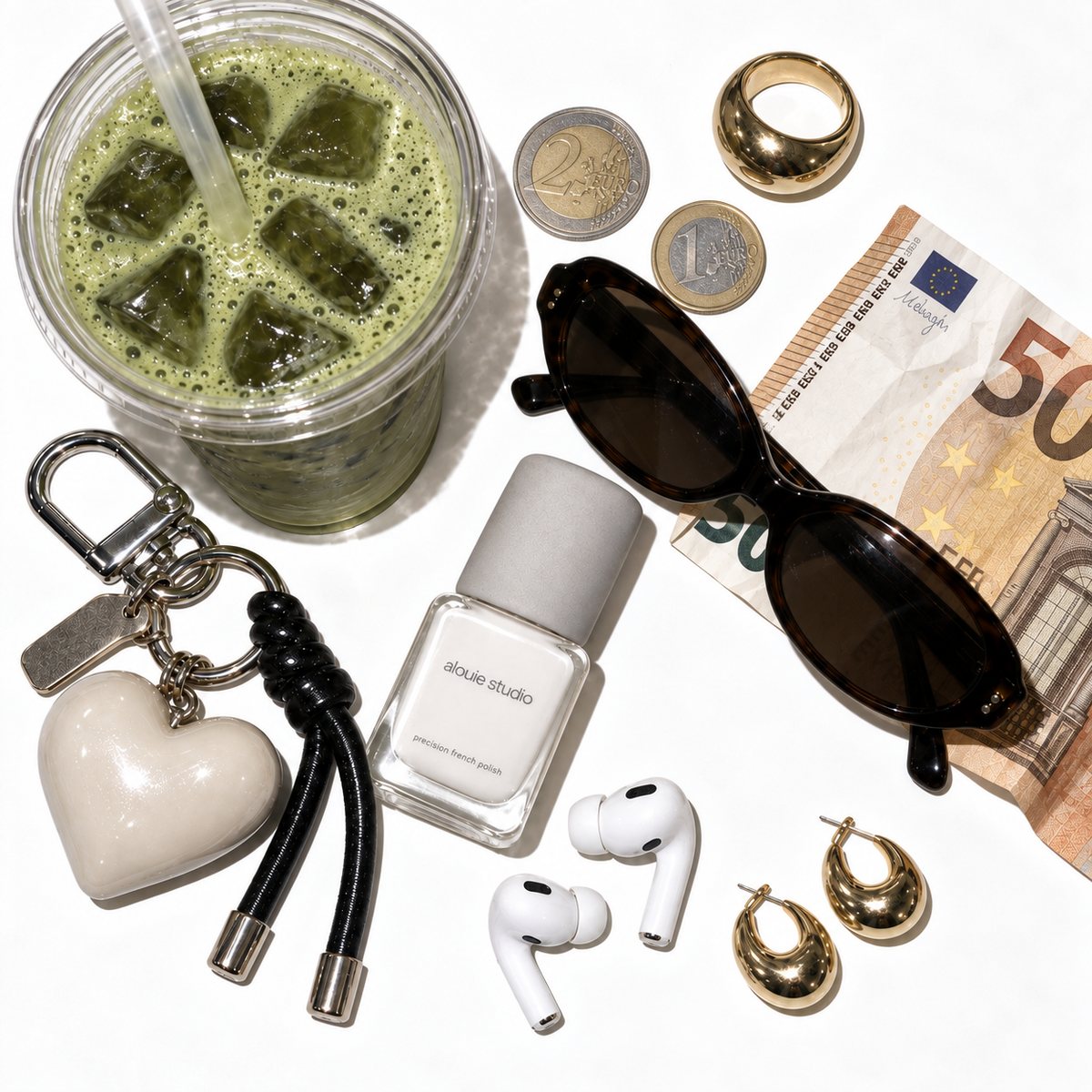 The polish laid out with sunglasses, earrings and everyday things