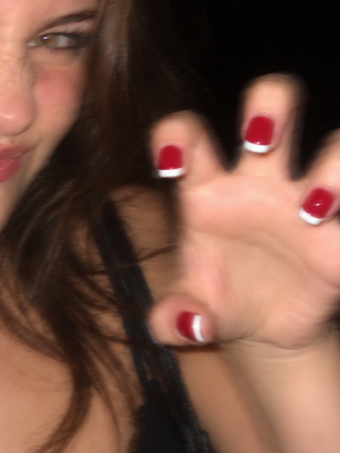 White french tips painted over red polish